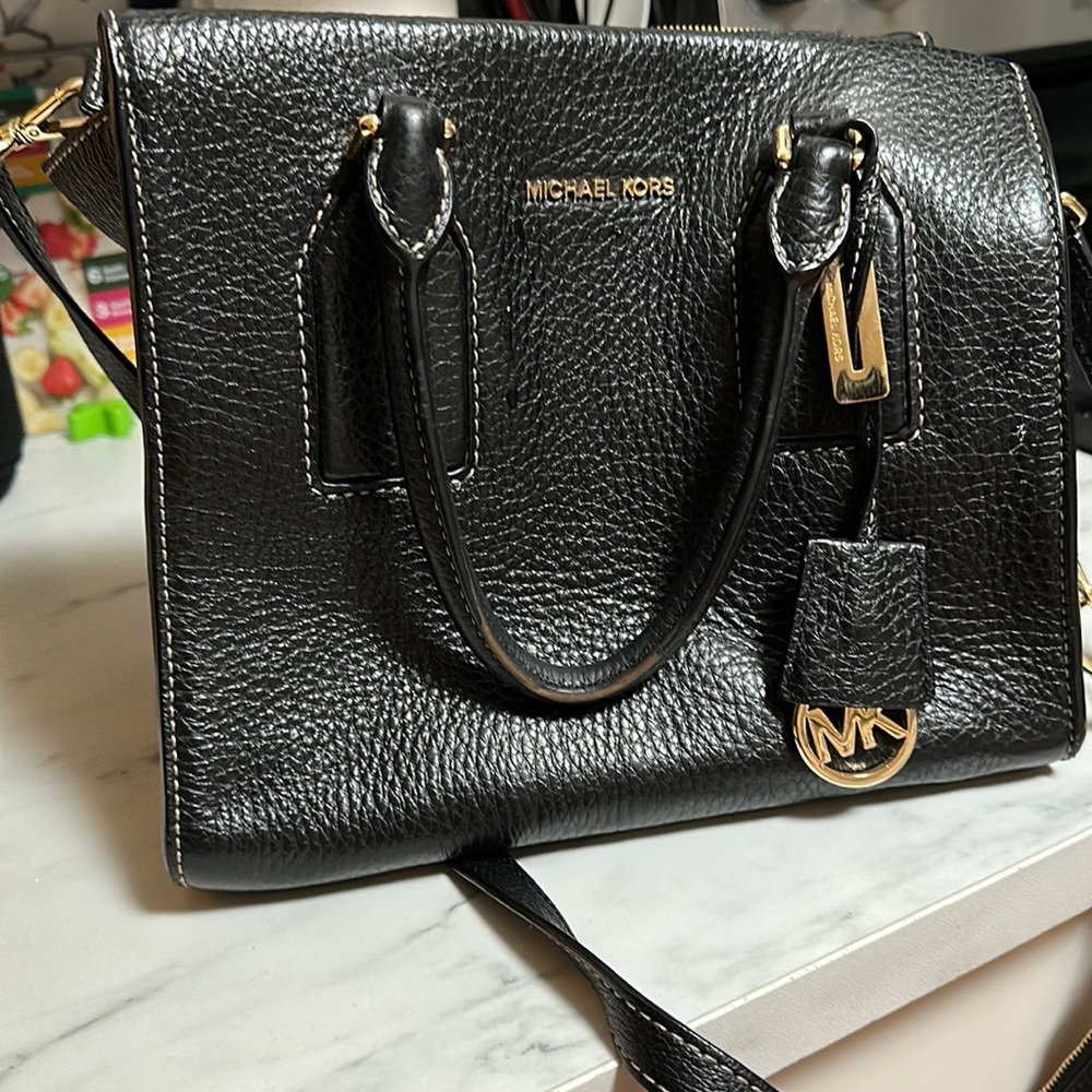 Older Micheal Kors square bag has been used but still in good condition